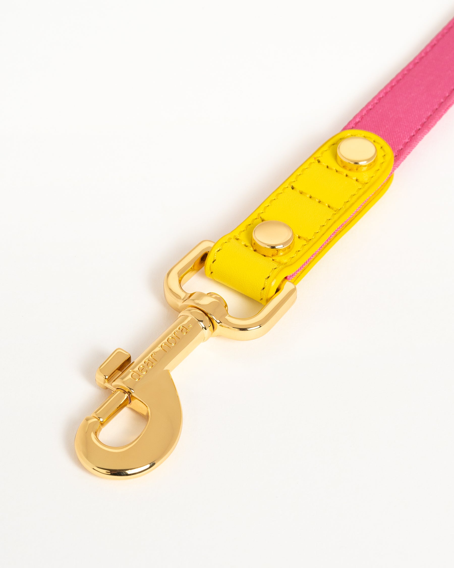 Dear Nora Bubblegum dog leash hook - yellow leather, pink fabric and 24k plated hardware - close up shot